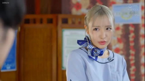 Blonde JAV therapist Momona Sarina in tight uniform, teasing gaze