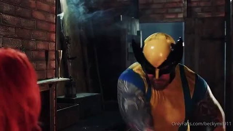 Rebecca Goodwin in red wig with Wolverine cosplay male performer