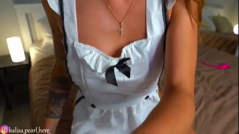 Kali in white maid dress showing cleavage and tattoos