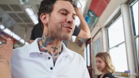 Kali Roses rides subway with tattooed guy in white shirt
