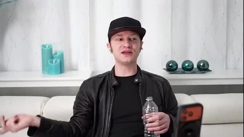 Alex Jett interview on Trike Patrol wearing black cap and leather jacket