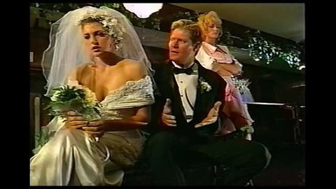 Wedding dress bride Gili Sky with Brian Surewood in tuxedo on bench