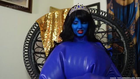 Blueberry model as Berry Queen in blue latex with crown