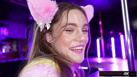 Juniper Ren in pink cat ears smiling at strip club VIP cum scene