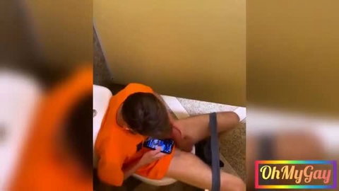 Prisoner in orange jumpsuit caught jerking off on toilet