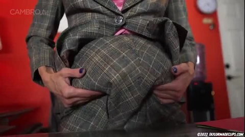 Blueberry in grey plaid suit during transformation fetish scene