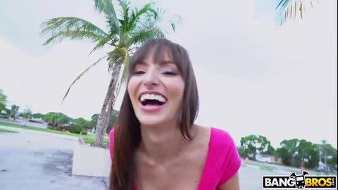 Lexi Luna smiling in pink top, outdoor adult video scene