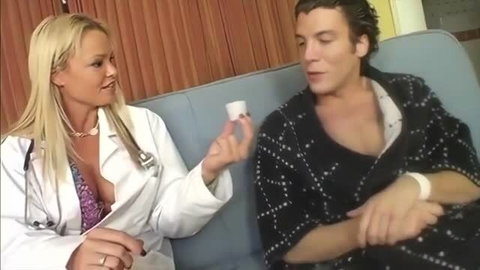 Phoenix Marie as doctor in white coat with male patient in bed