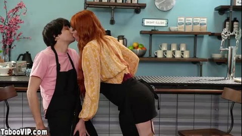 Lauren Phillips redhead MILF kissing young man in coffee shop apron