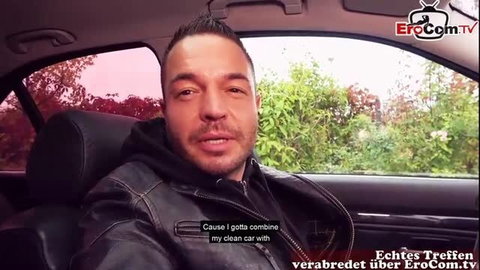 German macho in leather jacket filming selfie in car