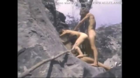 Vintage gay outdoor sex on rocky cliff with two naked men