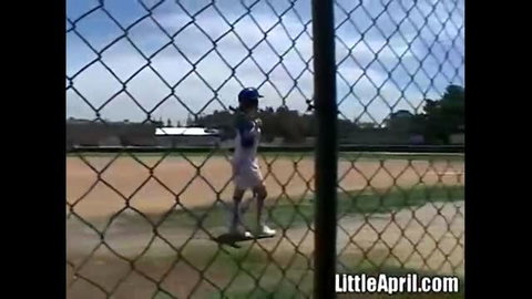 Little April rubbing pussy outdoors after baseball in uniform