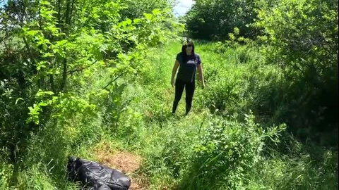 Brunette woman in black outfit outdoors near black jacket