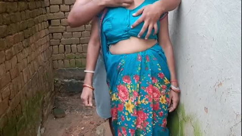 Indian girl in blue sari groped from behind in tight embrace
