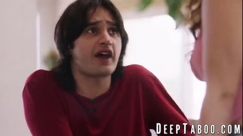 Leana Lovings in red top with emotional expression during scene