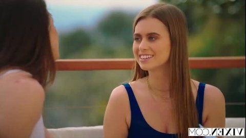 Jill Kassidy in blue top smiling during conversation with Tori Black