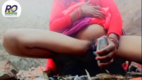 Indian bhabhi spreads legs and inserts bottle in ass