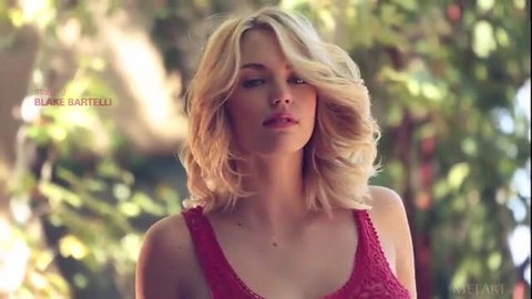 Blake Bartelli in red lingerie, blonde wavy hair, outdoor MetArt video thumbnail