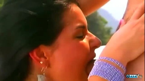 Brunette MILF giving passionate oral outdoors, close-up face shot