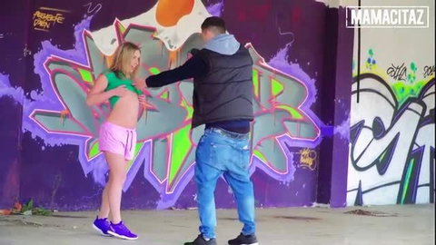 Daniella Margot in pink shorts lifts top for guy against graffiti wall