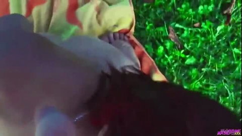 POV blowjob of huge cock by woman outdoors on grass