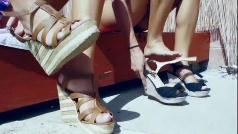 Brunette teen models in wedge heels teasing outdoors
