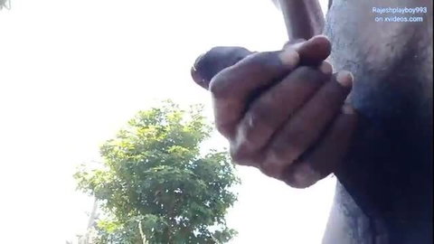 Dark-skinned man outdoors masturbating and cumming in amateur video