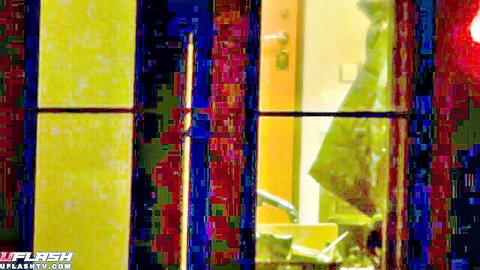 Mystery woman in raincoat teases her ass in dimly lit voyeur scene