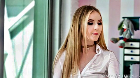Baby Kxtten in seductive white shirt and choker, blonde hair
