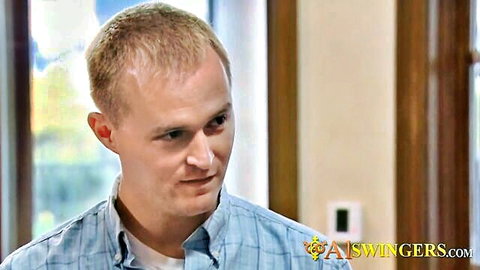 Blond Caucasian man in blue checkered shirt at swinger mansion party