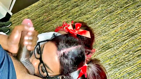 Brunette schoolgirl with pigtails glasses stares at ebony hand stroking massive wet pink cock near her mouth