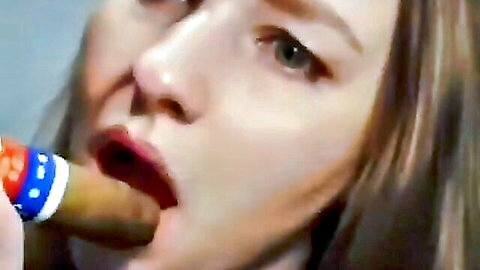 Close-up of brunette woman sensually smoking cigar with red lips