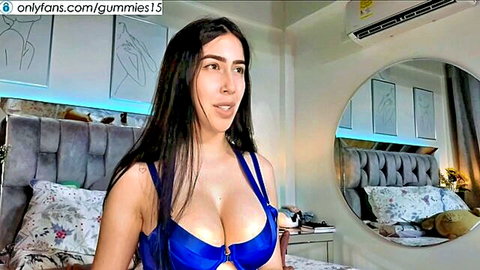 Sexy Latina in blue lingerie bustier, big cleavage, long black hair