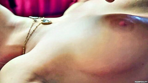 Scarlet Red topless with delicate necklace, exposing perky breasts