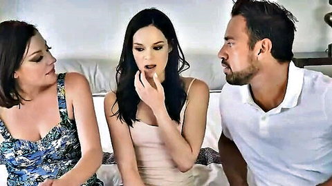 Two brunette babes in tank tops tease bearded stud on bed for threesome fuck