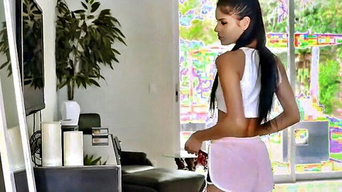 Amateur Latina big tits woman in crop top and shorts from behind