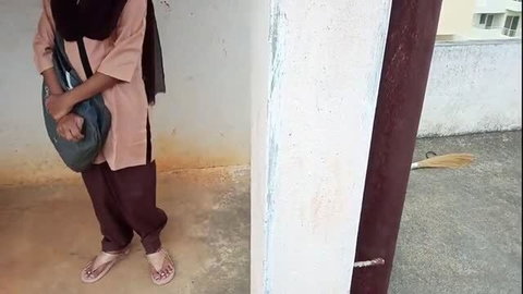 Indian woman in modest schoolgirl outfit standing outdoors