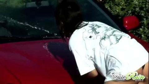 Cute Rain washing car in wet white t-shirt, no bra visible