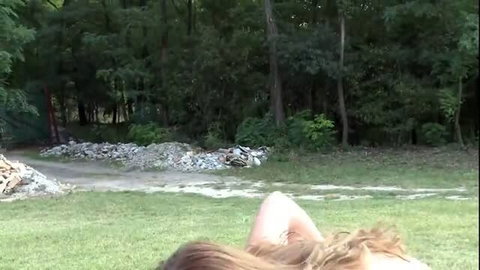 Outdoor lesbian BDSM domination scene with redhead