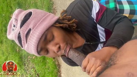 Dreadlocked Black man sucking thick dark cock on all fours