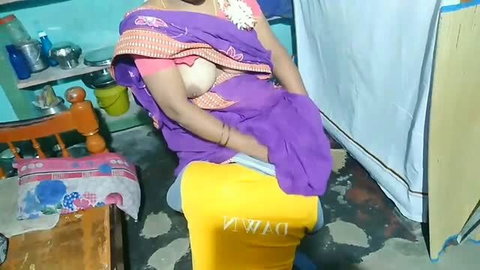 Indian auntie in purple sari exposing breast while cleaning