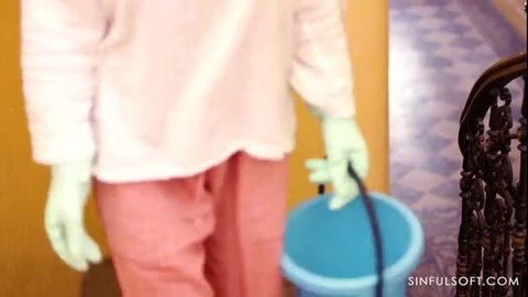 Angelica Heart or Anna De Ville in pink outfit and green gloves holding bucket