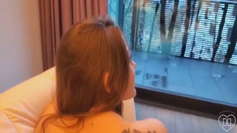 Dani Daniels topless with back tattoo facing window