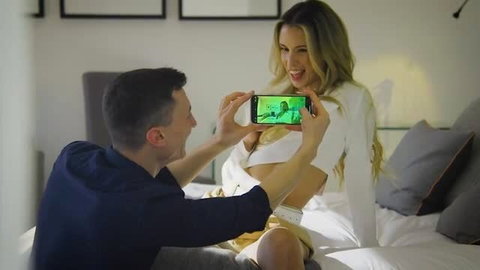 Blonde Mellany Lapiedra filmed on phone by Sam Bourne in bedroom