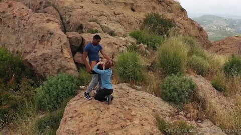 Stella Sedona gives Isiah Maxwell outdoor blowjob on rocky mountain trail