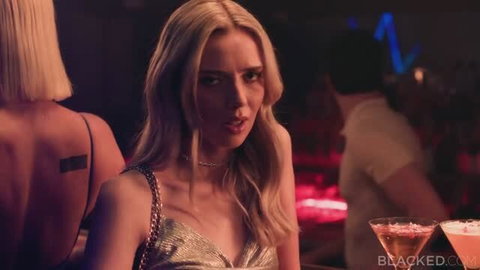 Hope Heaven in gold dress at bar, seductive gaze from Blacked interracial video