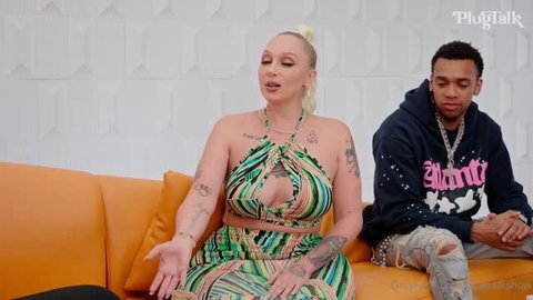 Alexis Andrews in colorful crop top on PlugTalk interview couch