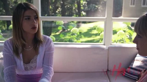 Scarlett Sage and Kristen Scott in sexy lingerie tops talking on couch