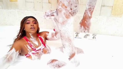 AndreaAndJean in foam-filled jacuzzi, wet lingerie, intimate bath scene