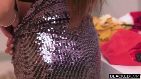Talia Mint in shiny sequin mini dress, close-up ass shot